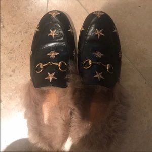 Gucci  slip ons with star and bee design.